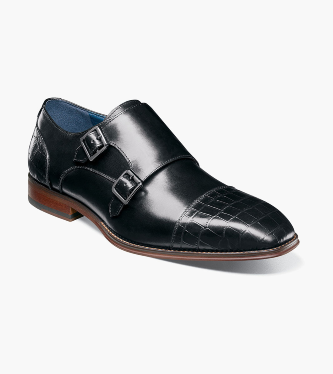 Black leather double monk strap shoes with crocodile embossed detail.