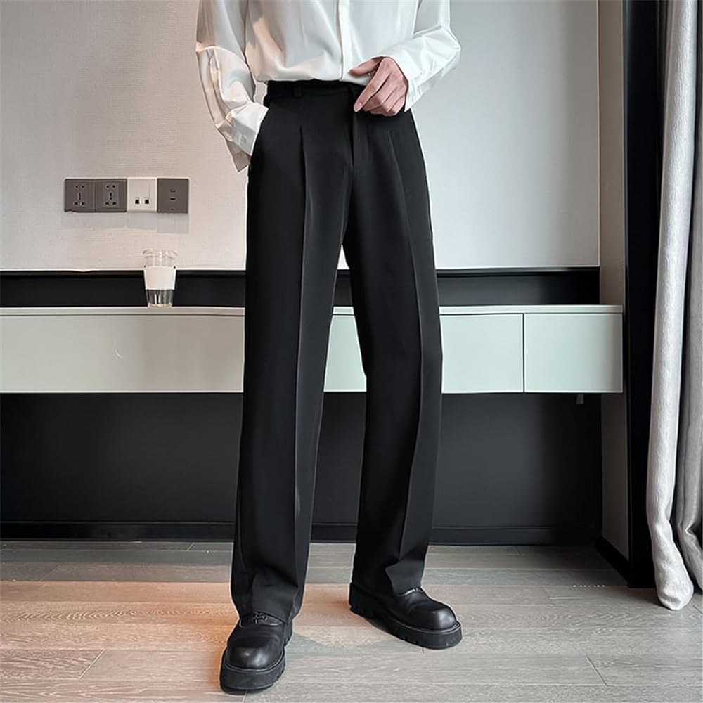 Man wearing baggy black dress pants and a white shirt