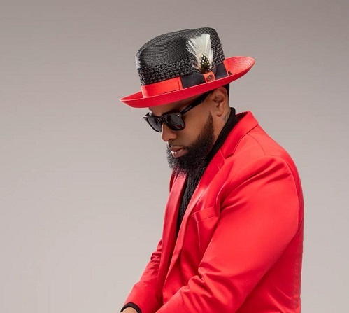 man wearing a red suit with a red and black hat