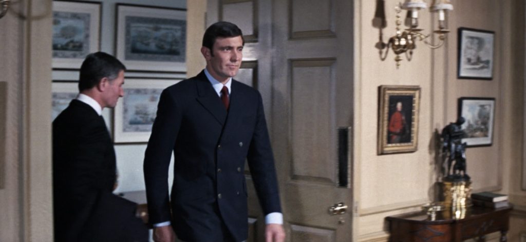 George Lazenby wearing a 6x4 double breasted suit