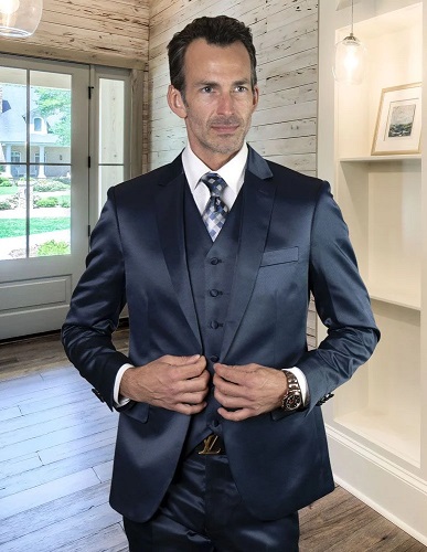 man wearing blue sharkskin suit with vest