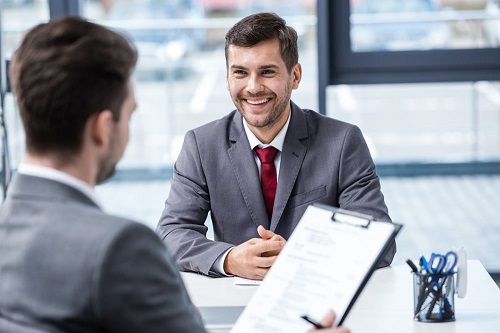 man wearing gray suit for interview