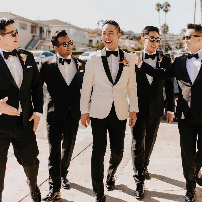 groom and groomsmen wearing suits