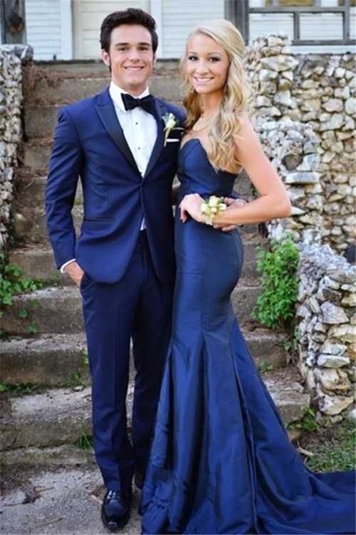 young man wearing royal blue hoco suit homecoming