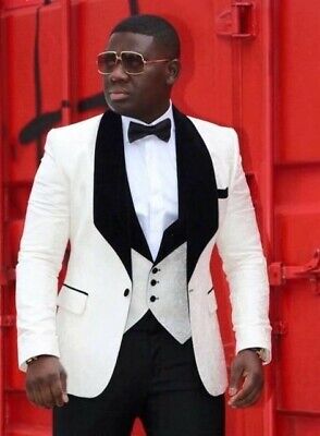 man wearing a white and black suit
